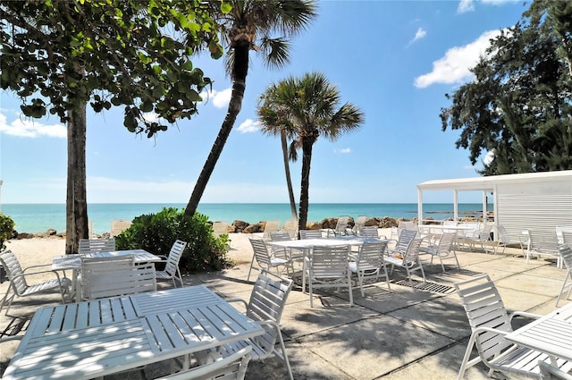 view of patio with a water view