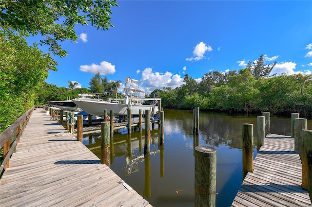 1249 S Basin Ln, Sarasota, FL 34242 - dock featuring a water view and boat lift