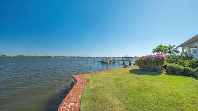 1249 S Basin Ln, Sarasota, FL 34242 - dock featuring a lawn and a water view
