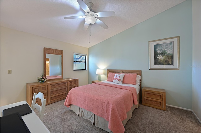 carpeted bedroom featuring ceiling fan, lofted ceiling, and a textured ceiling