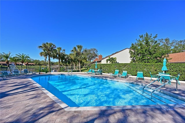 view of swimming pool featuring a patio