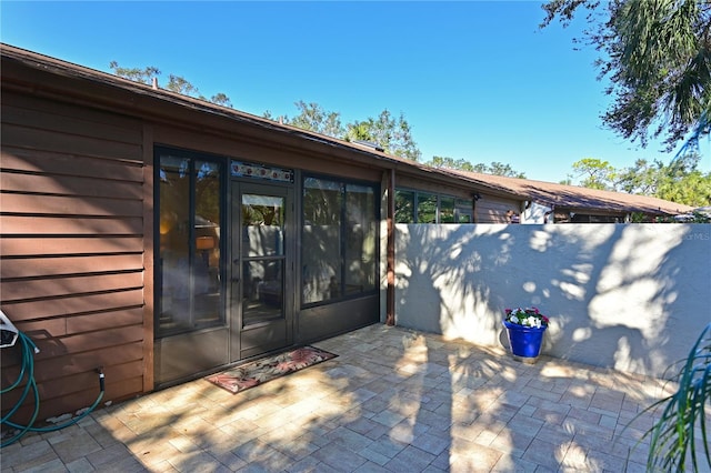 entrance to property with a patio area