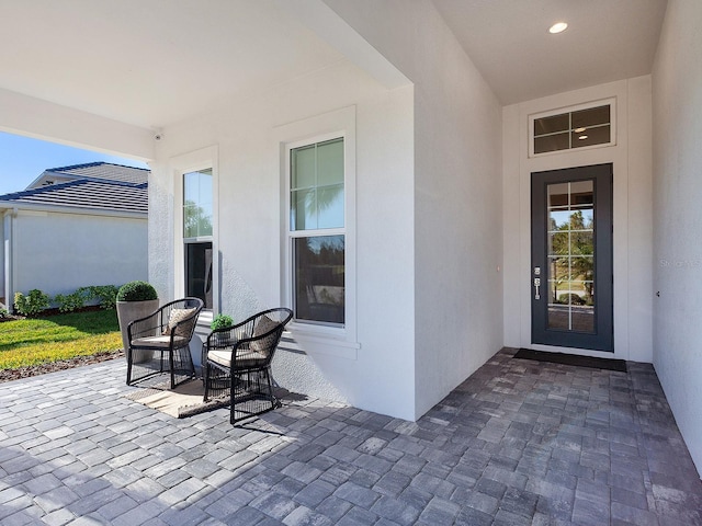 doorway to property with a patio area