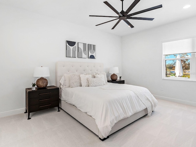 carpeted bedroom featuring ceiling fan