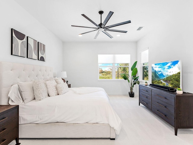 bedroom with light colored carpet and ceiling fan