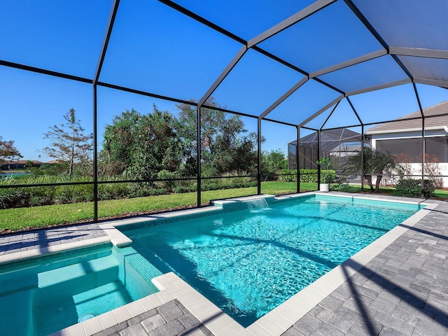 view of pool with glass enclosure