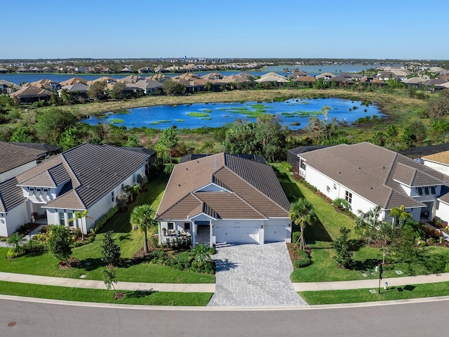 birds eye view of property with a water view