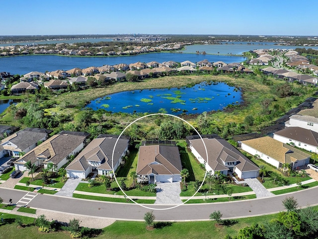 drone / aerial view featuring a water view