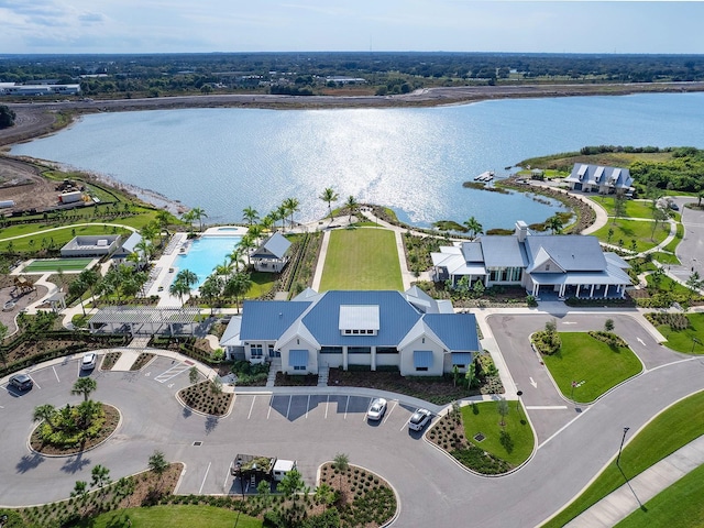 birds eye view of property with a water view