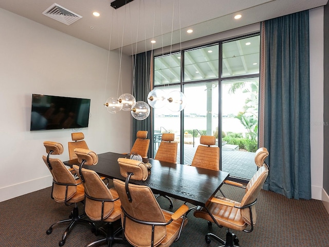 view of carpeted dining area