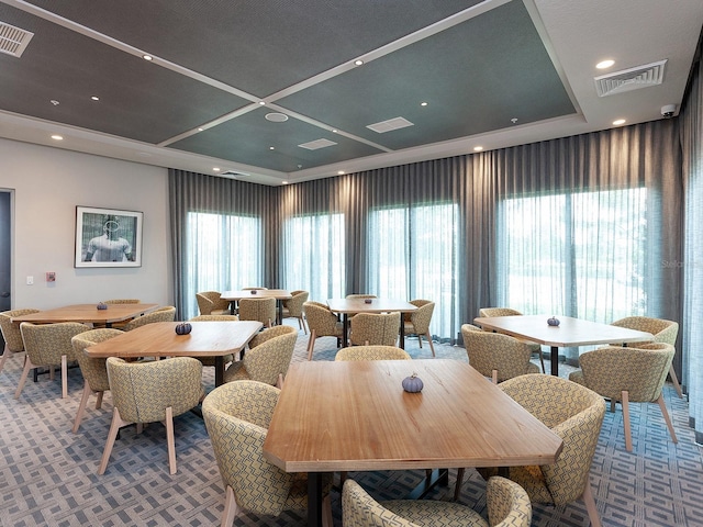 carpeted dining area featuring plenty of natural light