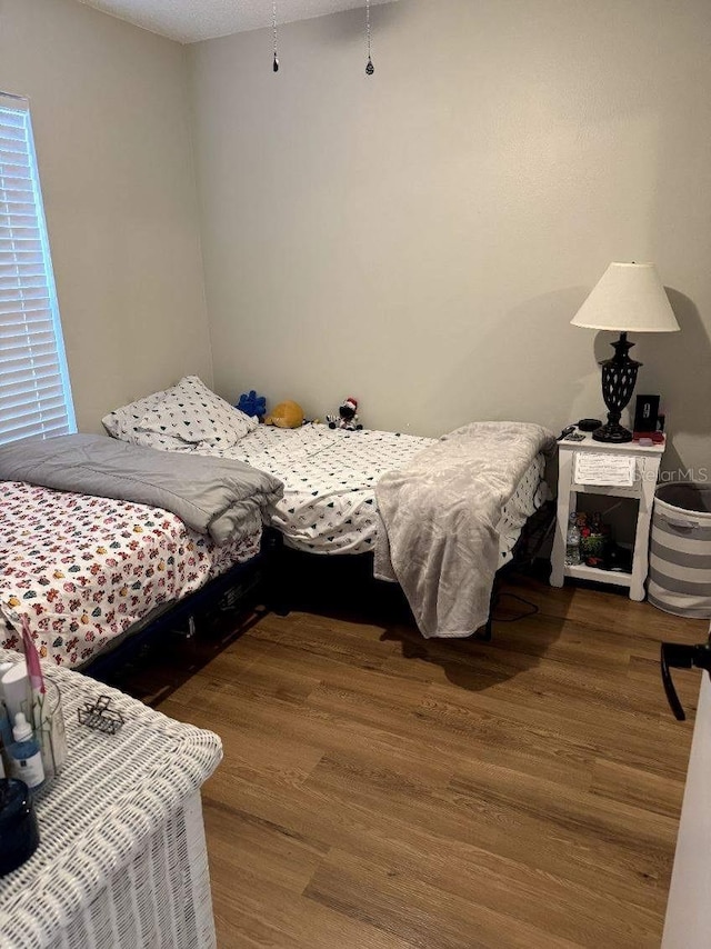 bedroom with hardwood / wood-style flooring