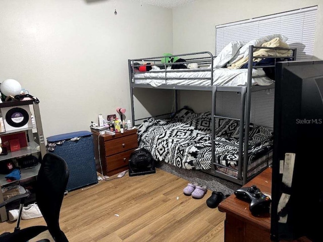 bedroom featuring hardwood / wood-style floors