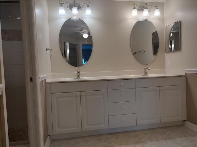 bathroom featuring ceiling fan and vanity