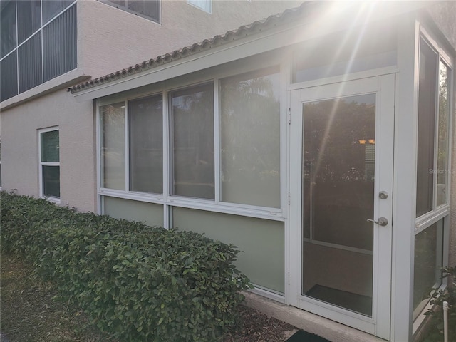 view of property exterior with french doors