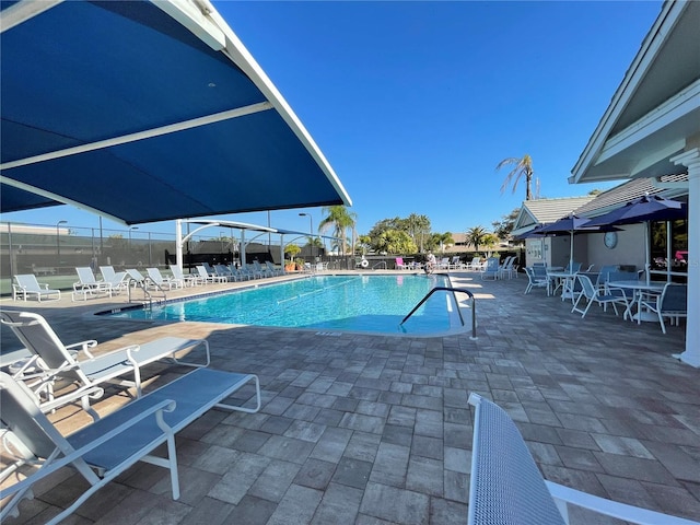 view of swimming pool featuring a patio