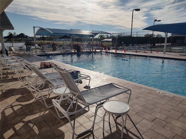 view of swimming pool with a patio