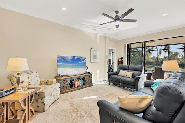 carpeted living room featuring ceiling fan