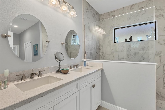 bathroom featuring vanity and a tile shower