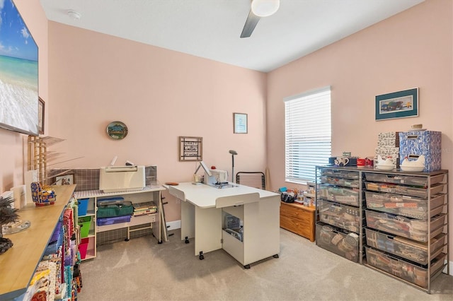 carpeted office featuring ceiling fan