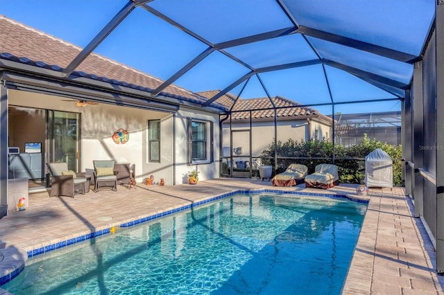 view of pool featuring a lanai and a patio area