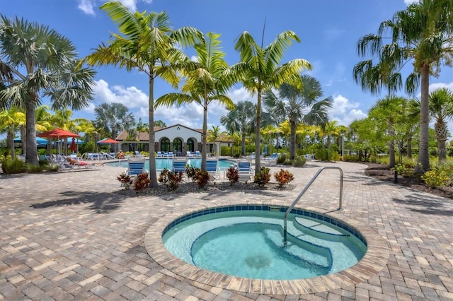 view of pool featuring a hot tub