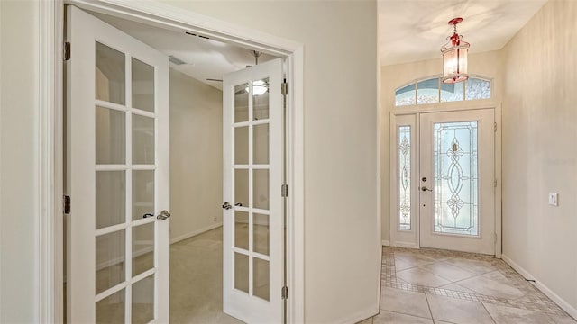 tiled entryway with french doors