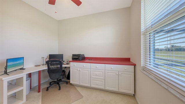 office area with light colored carpet and ceiling fan