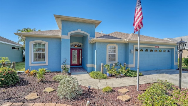 view of front of property with a garage