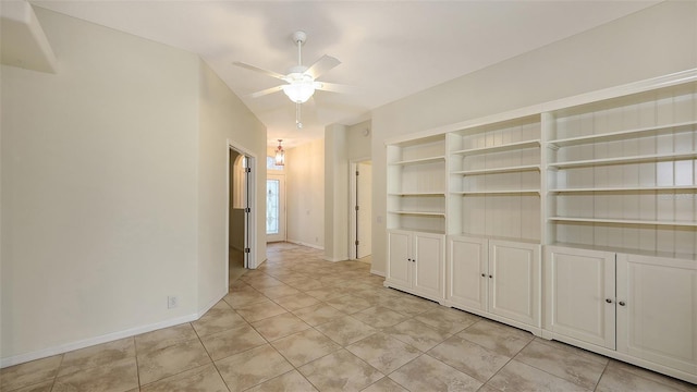 interior space featuring light tile patterned floors and ceiling fan