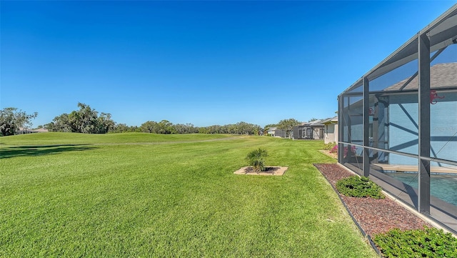 view of yard with a lanai