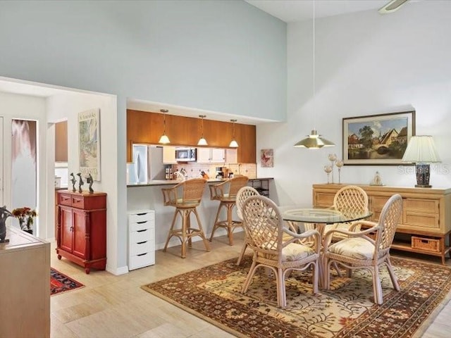 dining space with a high ceiling