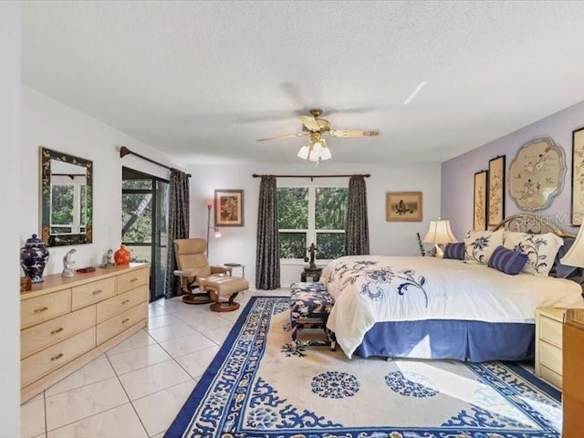 bedroom featuring light tile patterned floors, a textured ceiling, and ceiling fan