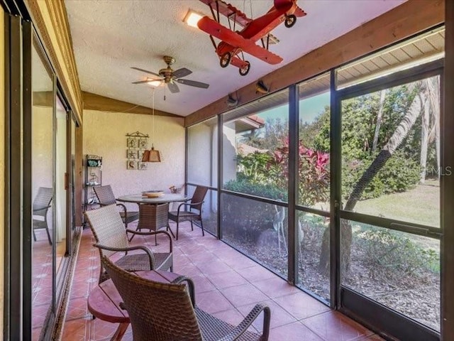 sunroom featuring ceiling fan