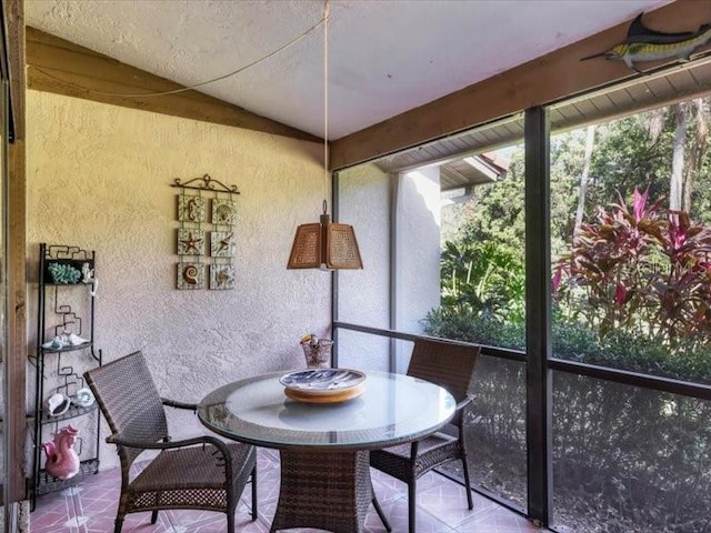 sunroom / solarium with vaulted ceiling