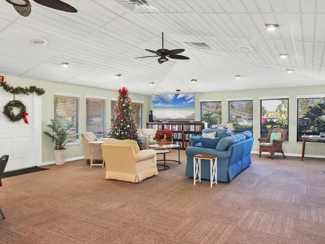 living room with carpet and ceiling fan