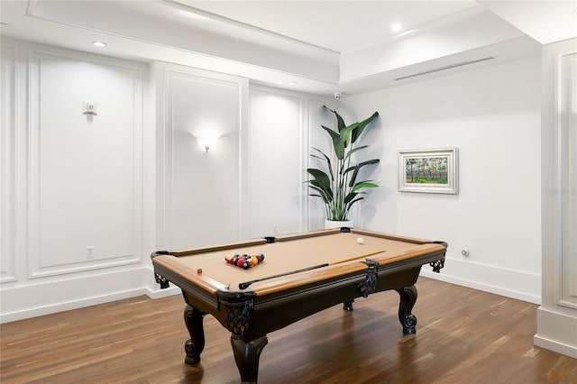 playroom with wood-type flooring, a raised ceiling, and pool table