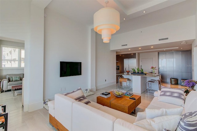 living room with a high ceiling