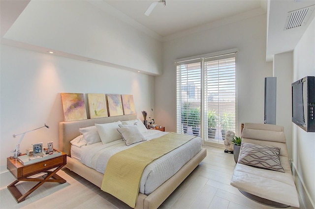 bedroom featuring access to exterior, ceiling fan, and crown molding