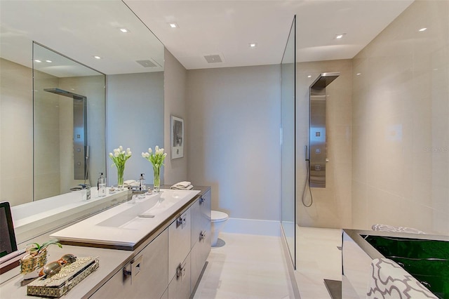 bathroom featuring vanity, toilet, and walk in shower