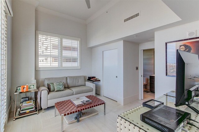 living room featuring crown molding