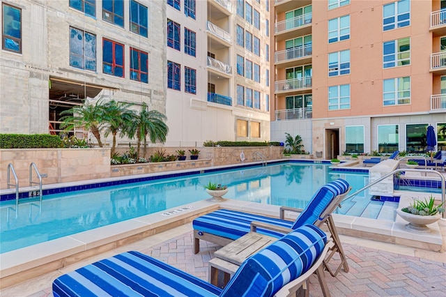 view of swimming pool with a patio