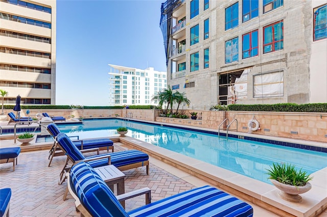 view of swimming pool featuring a patio area