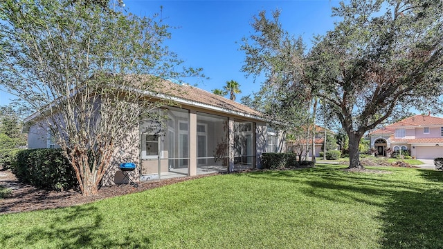 view of yard featuring a sunroom