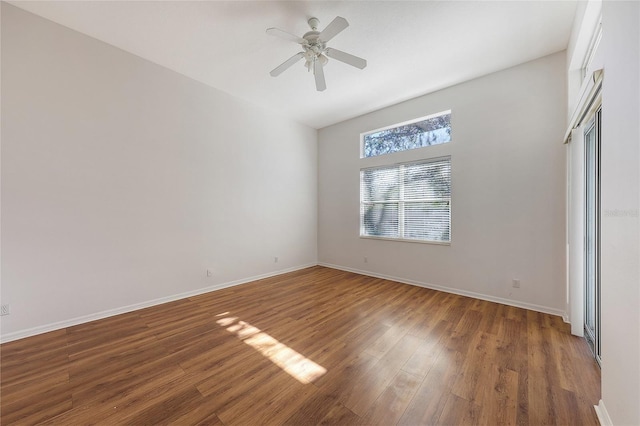 unfurnished bedroom featuring ceiling fan and dark hardwood / wood-style floors