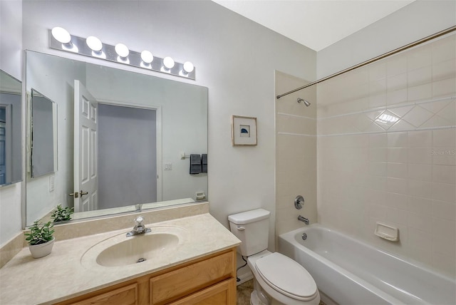 full bathroom with tiled shower / bath combo, toilet, and vanity