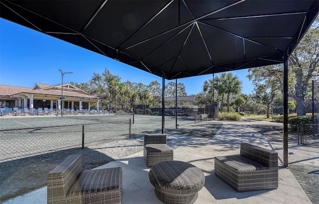 view of patio with tennis court