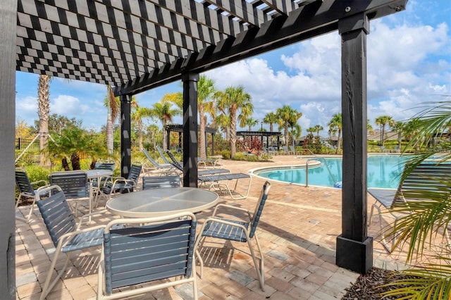 view of patio / terrace with a pergola and a community pool