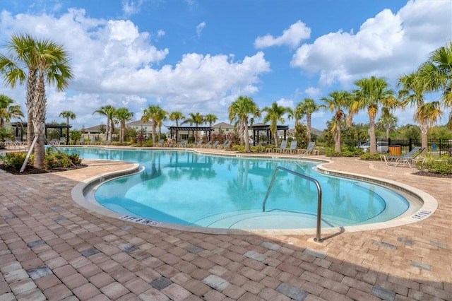 view of swimming pool with a patio area