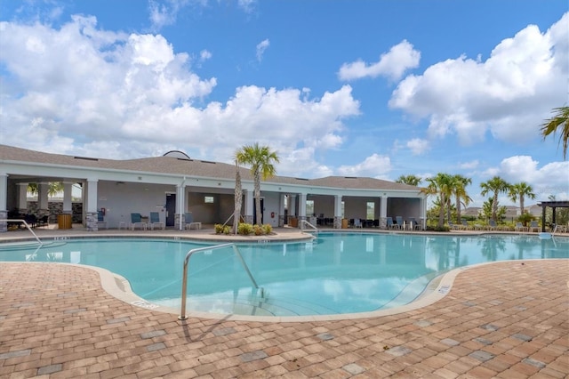 view of swimming pool with a patio